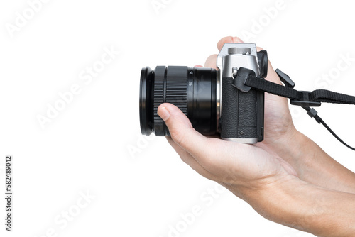 Hand holding vintage camera shooting side view isolated on transparent background