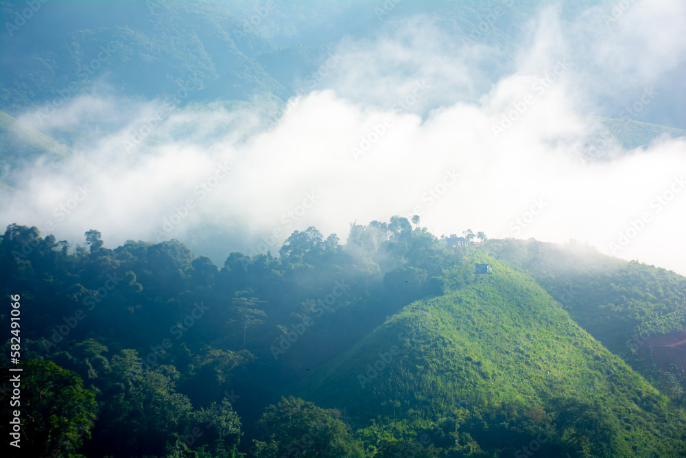 Beautiful mountains under mist in the morning,fog and cloud tropical landscape Welcoming travelers.