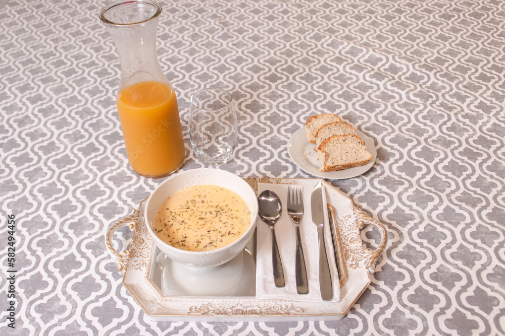 Fish soup served in a dish with juice and slices of bread on a tablecloth. Fish soup served in a dish with juice and slices of bread on a tablecloth.