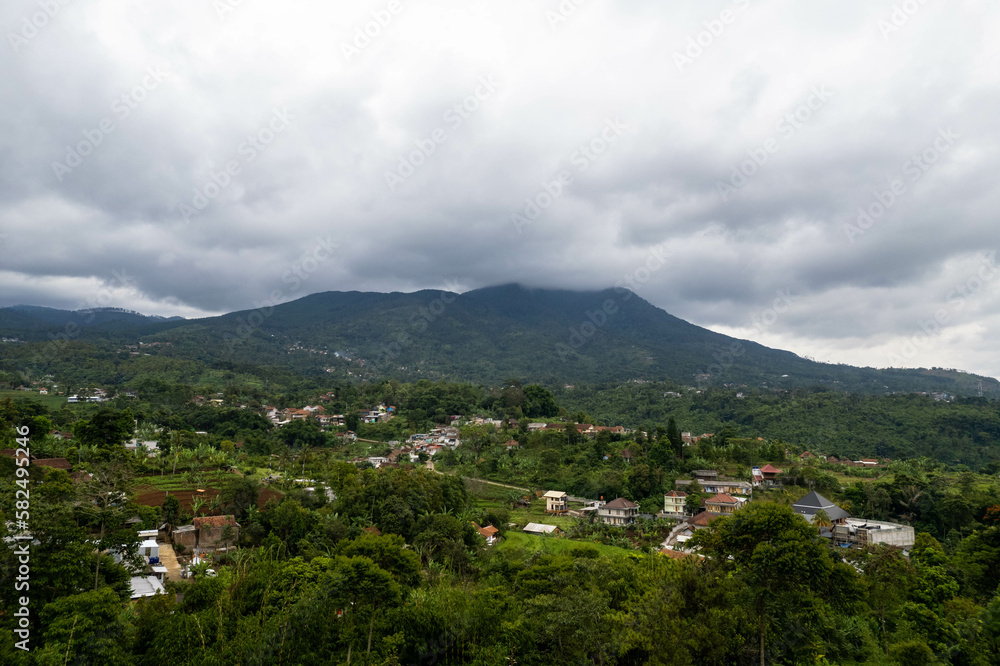 Fototapeta premium Rural and mountain landscape with heavy clouds