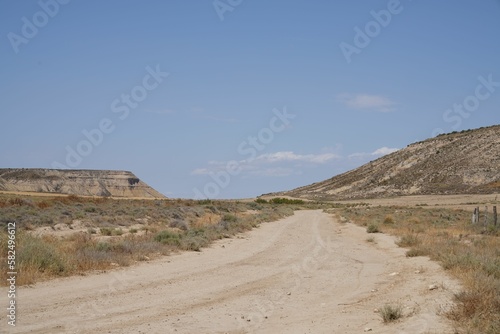 Daytime view of a road in a deserted area landscape