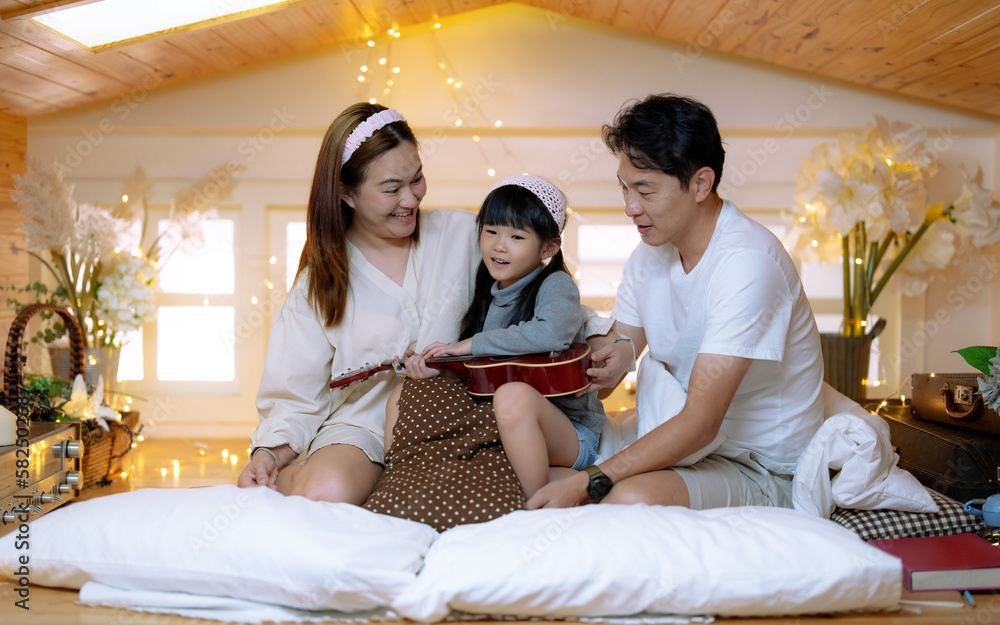 Fototapeta premium Happy Asian family spending time together at home.