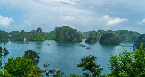 Rock formations with the landscape and boats view in Ha Long Bay  Vietnam
