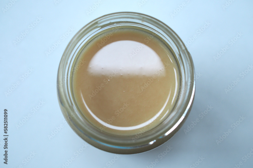 Top view of open jar of honey Top view of open jar of honey