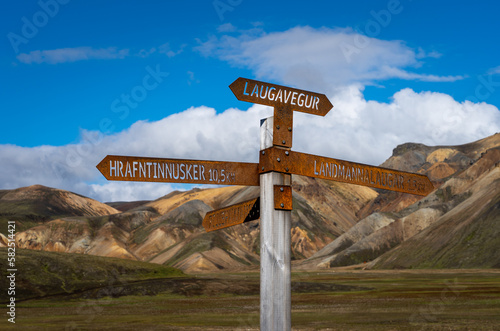 Laugavegur sign post in colorful rhyolite mountains,  Landmannalaugar, Iceland. Laugavegur hiking trail in Iceland