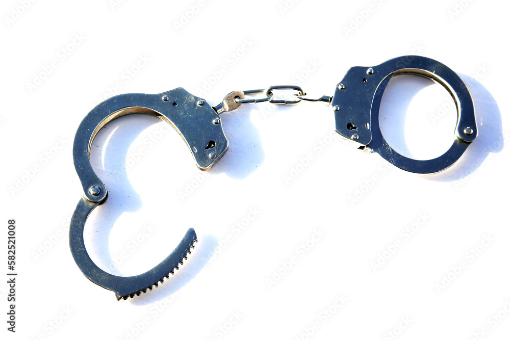 Handcuffs. Hinged Galvanized Handcuffs. Handcuffs isolated on white transparent background. Metal chain and locked cuffs.
Handcuffs. Hinged Galvanized Handcuffs. Handcuffs isolated on white transparent background. Metal chain and locked cuffs.