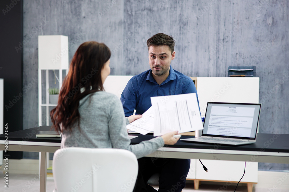 Two Businesspeople Talking With Each Other Two Businesspeople Talking With Each Other
