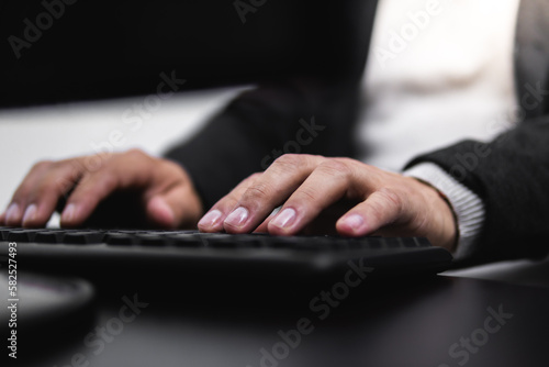 Man working on corporate or business desktop computer giving a concept of international business