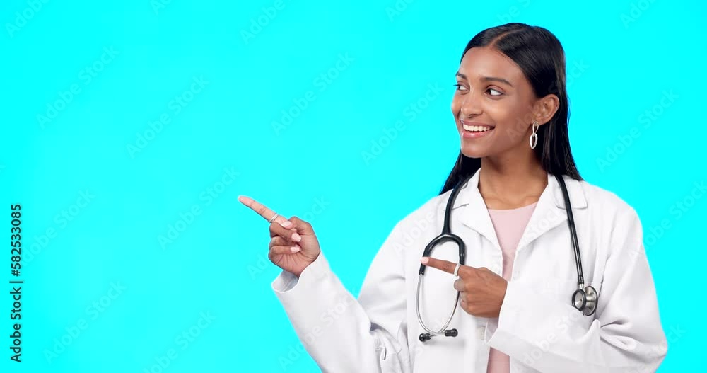 Medical doctor, healthcare and happy woman point at mock up promotion, hospital notification or announcement mockup. Nurse portrait, studio advertising surgeon or marketing female on blue background Medical doctor, healthcare and happy woman point at mock up promotion, hospital notification or announcement mockup. Nurse portrait, studio advertising surgeon or marketing female on blue background