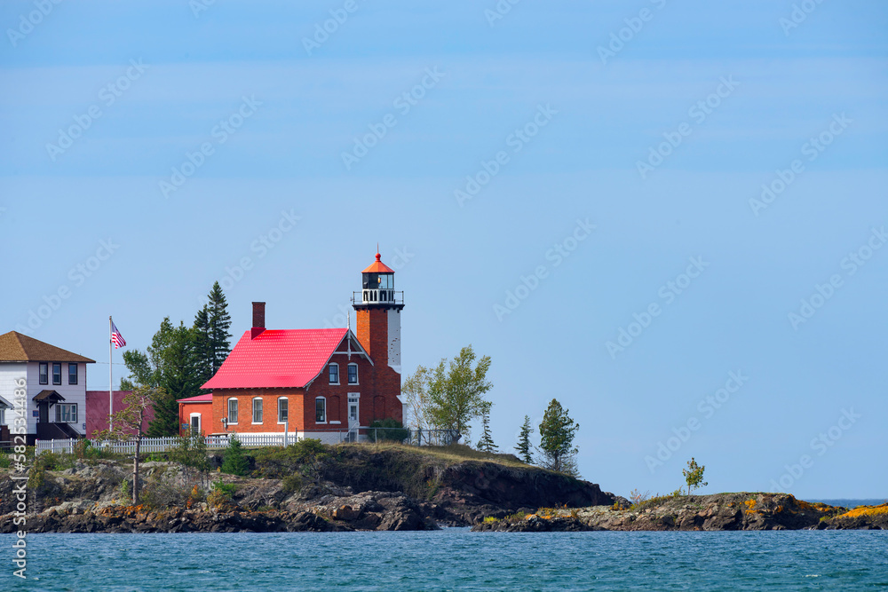 lighthouse on the shore of the lake