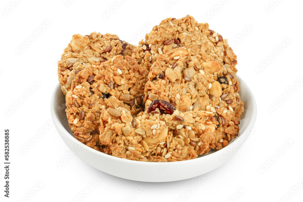 Granola cookie in ceramic bowl isolated on white background with full depth of field Granola cookie in ceramic bowl isolated on white background with full depth of field