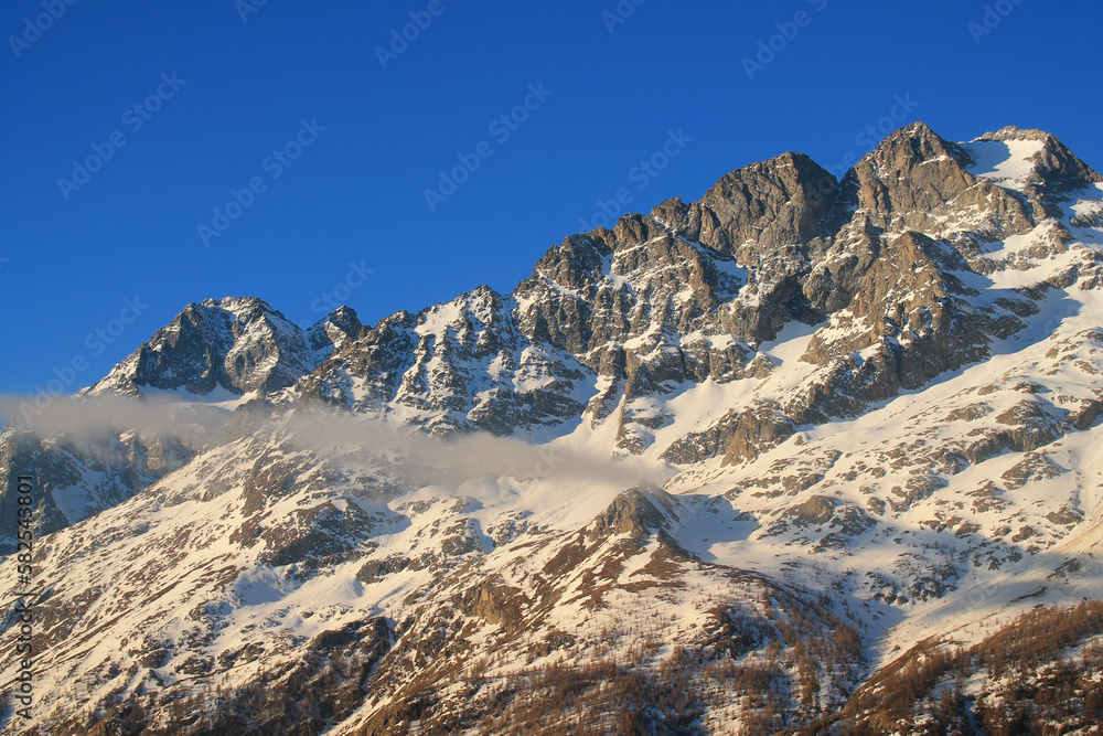 The beautiful Pontet Lake in the french Alps with view on La Meije mountain The beautiful Pontet Lake in the french Alps with view on La Meije mountain