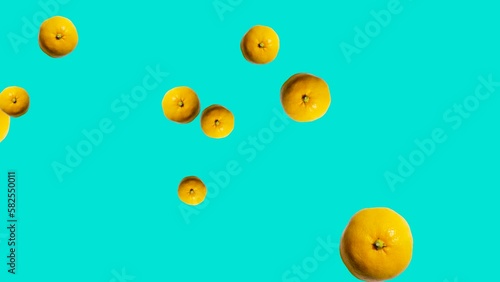 Abstract explosion with Tangerines flying in different directions on a blue background. Creative colorful food animation concept with fruits (ID: 582550011)