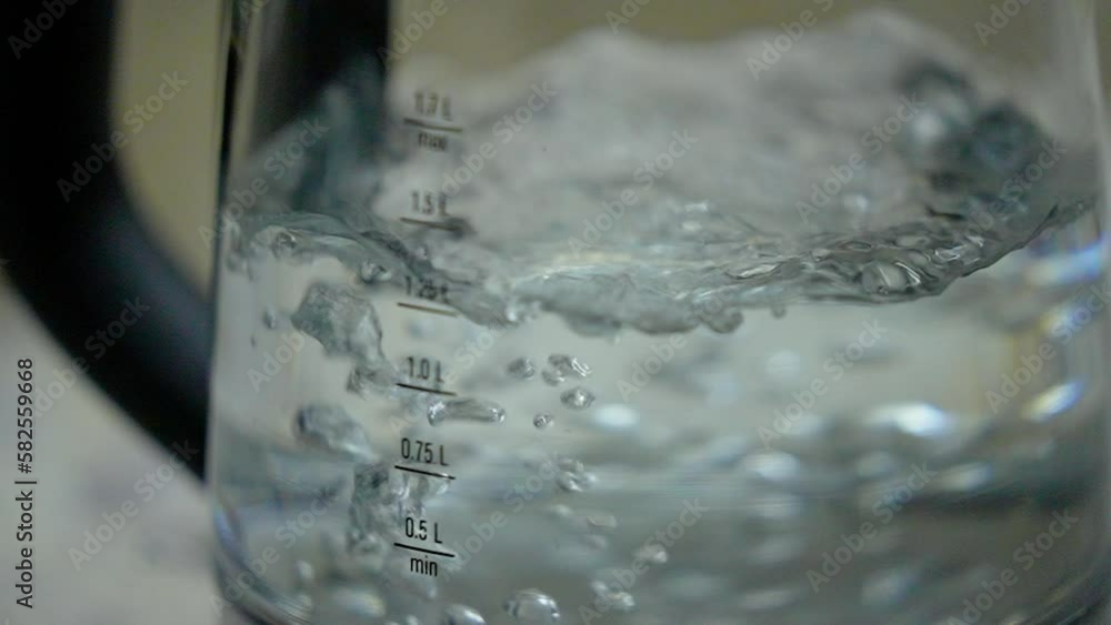 Electric glass kettle boils water. Measuring column, the amount of