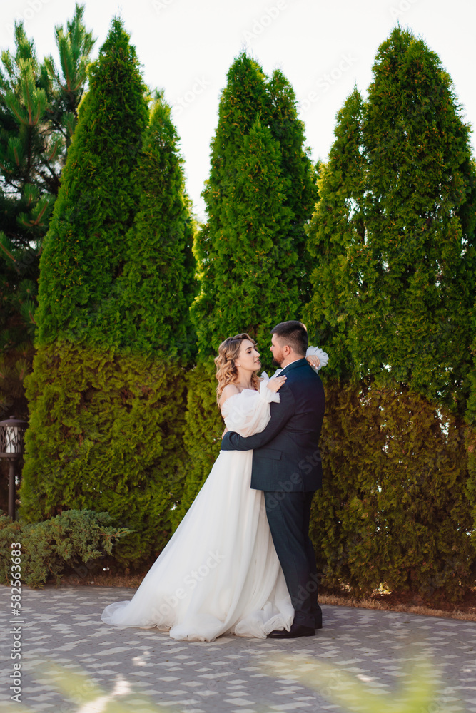 lovers and gentle dancing happy bride and groom in nature. 