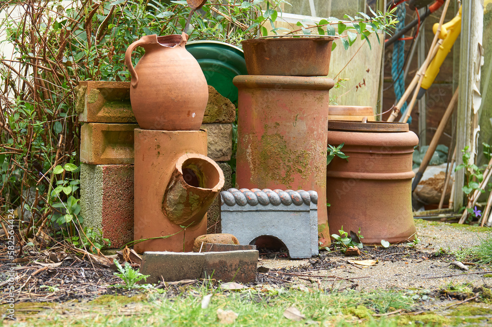 Old terracotta plant pots in a garden