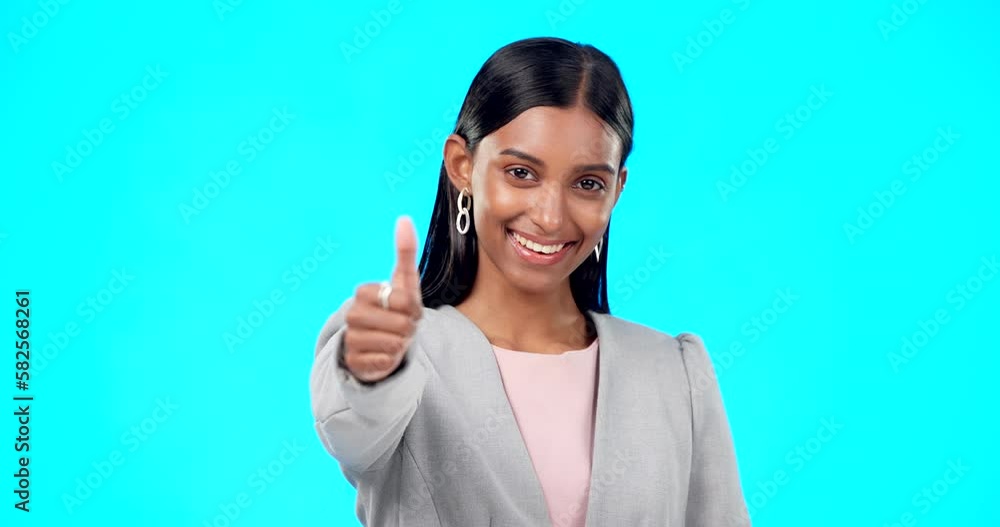 Thumbs up, perfect and happy businesswoman doing accept hand gesture, sign or symbol with smile. Excited, agreement and portrait of female showing approval isolated in blue studio background Thumbs up, perfect and happy businesswoman doing accept hand gesture, sign or symbol with smile. Excited, agreement and portrait of female showing approval isolated in blue studio background