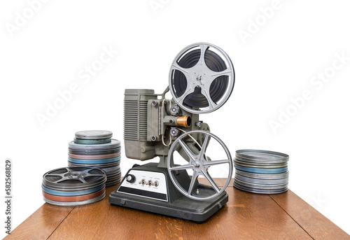 Vintage 8 mm home movie projector and film cans with cut out background. photo