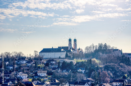 View at the small town Vilshofen and Schweiklberg abbey in early spring in late afternoon light