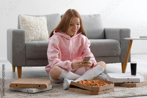 Young woman with tasty pizz...