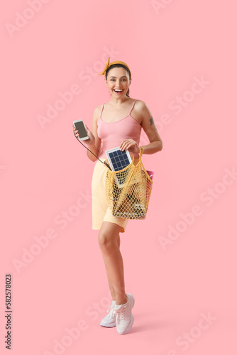 Pretty young woman charging...