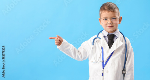 Cute little doctor pointing...