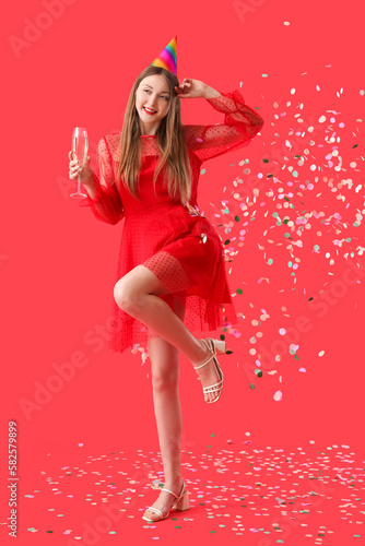 Happy young woman with glas...