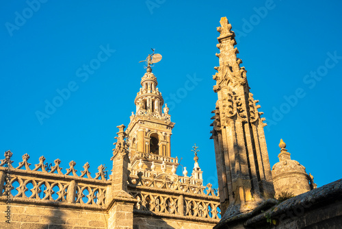 View of La giralda the bell tower of the cathedral of Seville from the rooftop of the cathedral, It was originally built as the minaret for the Great Mosque of Seville in al-Andalus, Moorish Spain