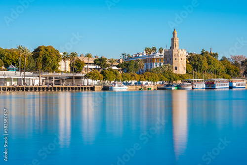 Long exposure of Guadalquivir River from Triana with the Torre del Oro and seville in the background photo