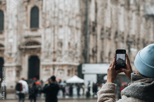 Tourist taking a photo of a cathedral