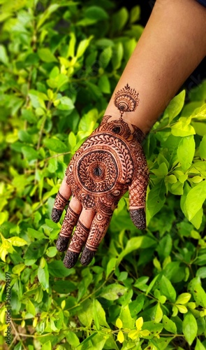 Simple Henna art  on hands  photo