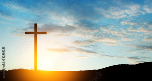 Christian cross on hill outdoors at sunrise. Resurrection of Jesus. Concept photo. © hamara