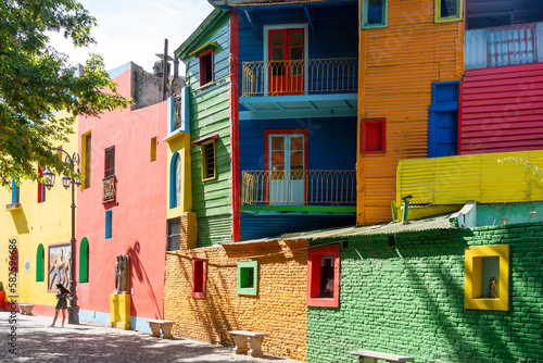 The colorful buildings at  Caminito street museum with an unrecognizable people in La Boca, Buenos Aires, Argentina in January, 2023. Caminito was a port area where Tango was born. 