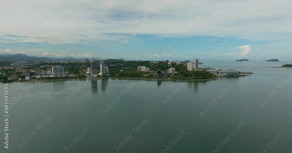 Aerial view of the city of Kota Kinabalu from the sea. Borneo, Sabah, Malaysia. Aerial view of the city of Kota Kinabalu from the sea. Borneo, Sabah, Malaysia.