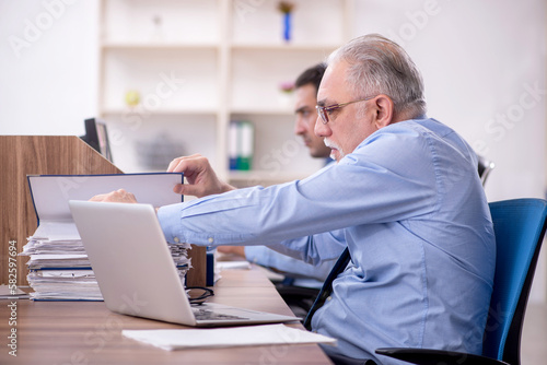 Two male colleagues working in the office