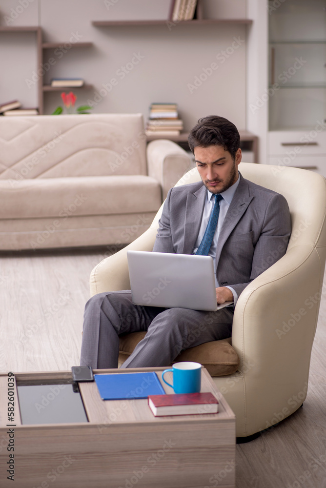 Young male employee working from home Young male employee working from home