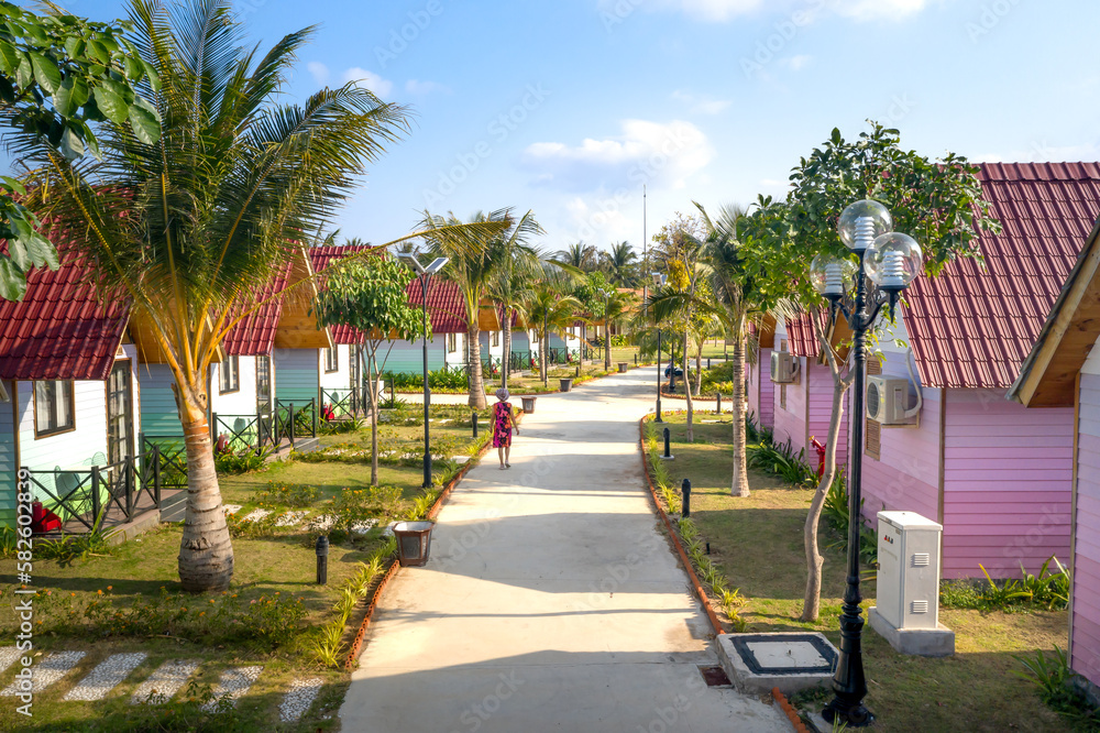 Overview of 4-star TTC resort with rows of bungalows at Ninh Chu beach Van Hai ward , Son Hai, Phan Rang city, Vietnam - obrazy, fototapety, plakaty 