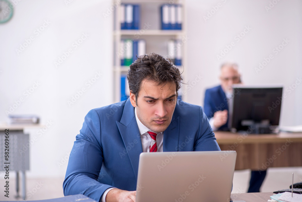 Two male colleagues working in the office Two male colleagues working in the office