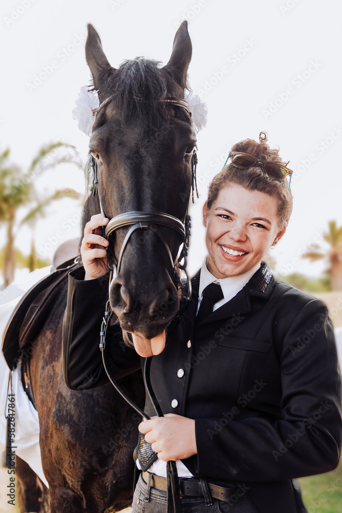 Obraz premium Female rider and her horse funny portraits