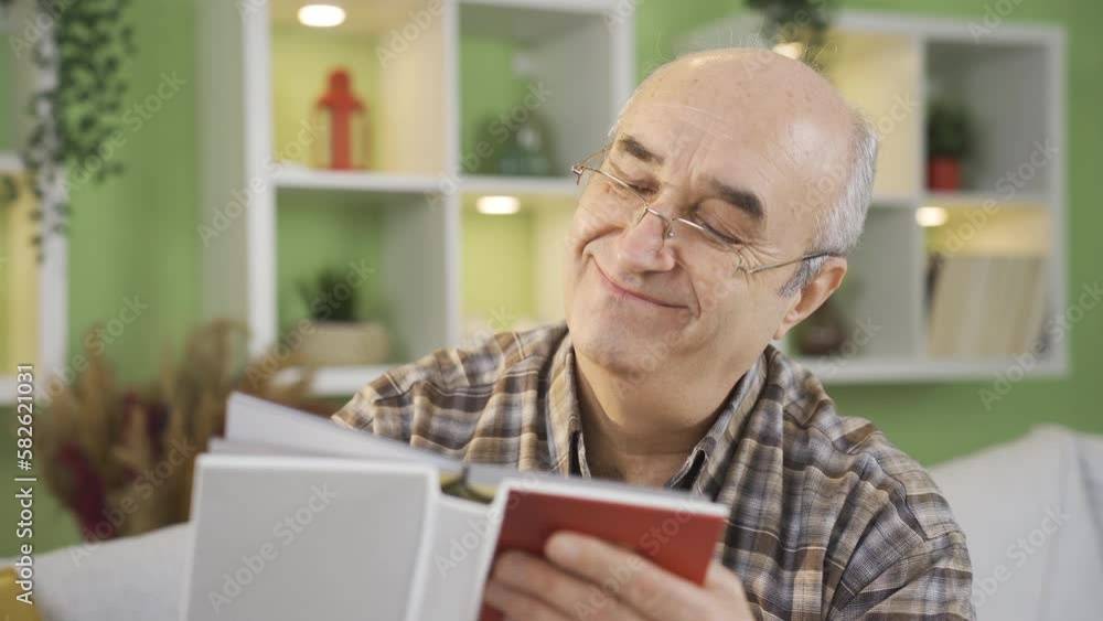 Old man looking at photo album.
The photo album, which reminds of the old days at home, makes the old man feel and think.
Old man looking at photo album.
The photo album, which reminds of the old days at home, makes the old man feel and think.