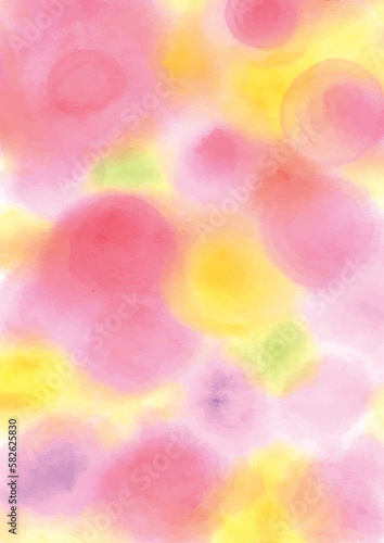 ピンクや黄色の水彩絵の具をにじませたカラフルな暖色背景