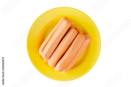 Many pieces of chicken sausage on a plate, top view shot