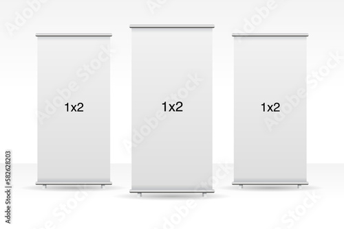 Set of 3 empty standee or rollup banner display mockup on isolated white background. Display mockup for presentation or exhibition product. Vertical blank roll up stand template in 1x2 sizes.