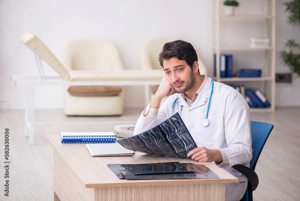 Fototapeta premium Young male doctor radiologist working in the clinic