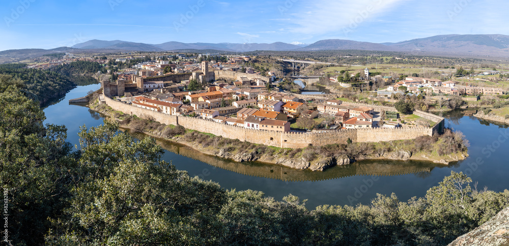 Landscape with a view of the walled town of Buitrago del Lozoya and the river from the mountains