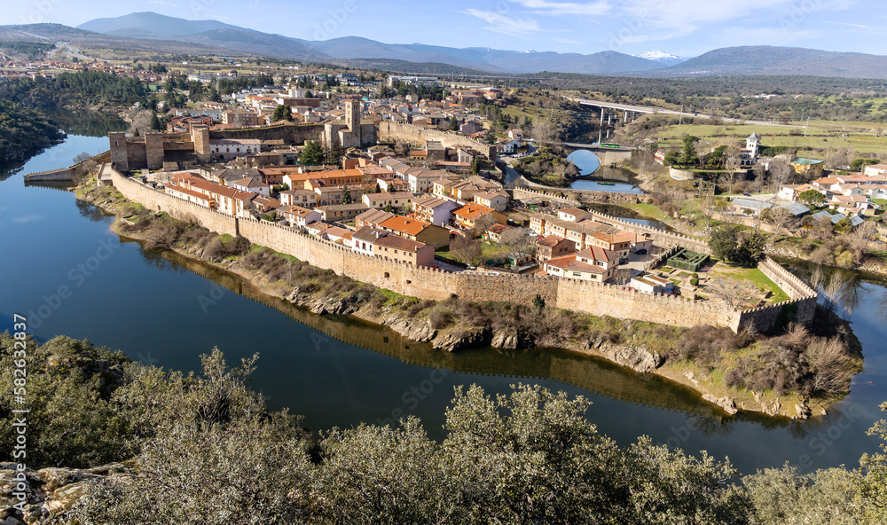 Landscape with a view of the walled town of Buitrago del Lozoya and the river from the mountains