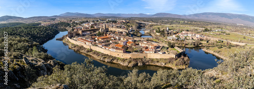 Landscape with a view of the walled town of Buitrago del Lozoya and the river from the mountains