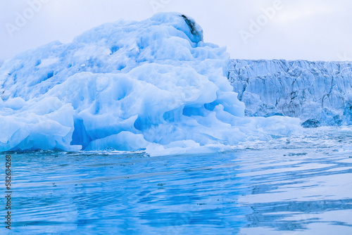 Iceberg by a glacier in the arctic