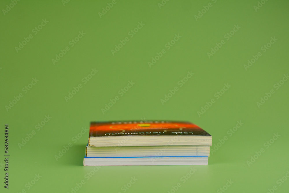 Books. Stack of books stacked on light green background. Reading. Reading concept. and collection of books Books. Stack of books stacked on light green background. Reading. Reading concept. and collection of books