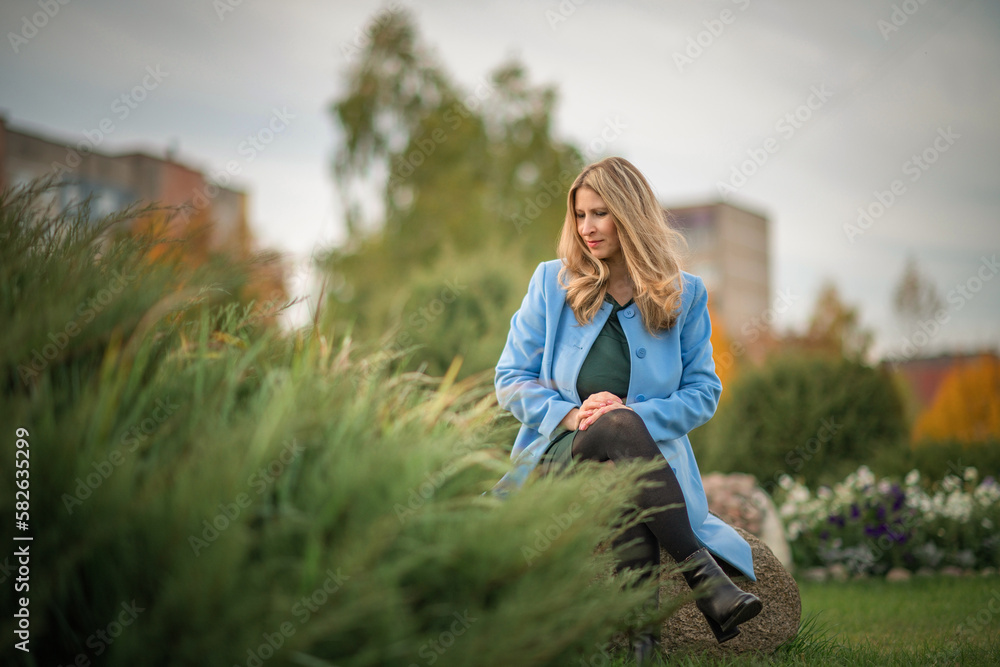 Portrait of a young beautiful blonde girl outdoors in spring. Portrait of a young beautiful blonde girl outdoors in spring.